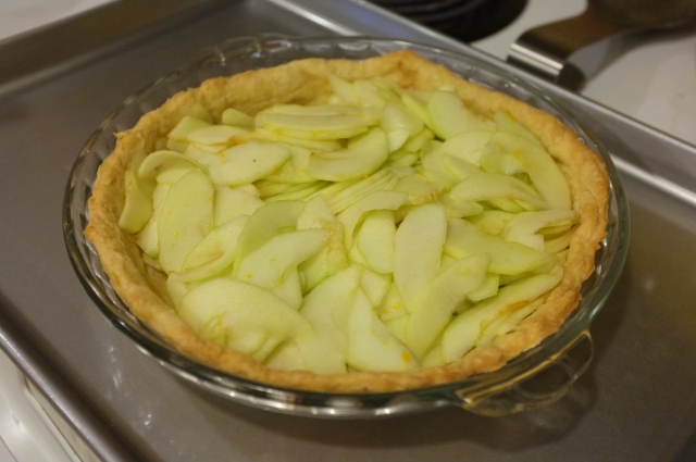 Apples in the pre-baked crust, ready to bake a bit